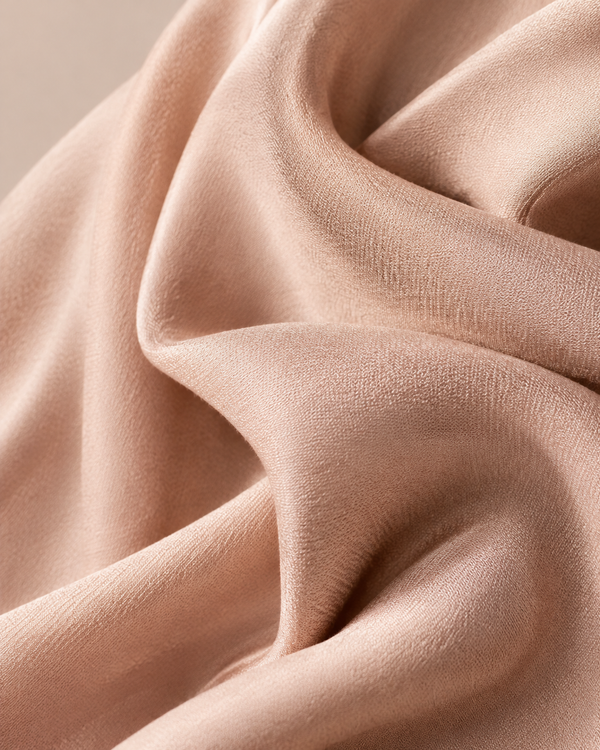 Draped bio-based fabric in rose-gold editorial tones